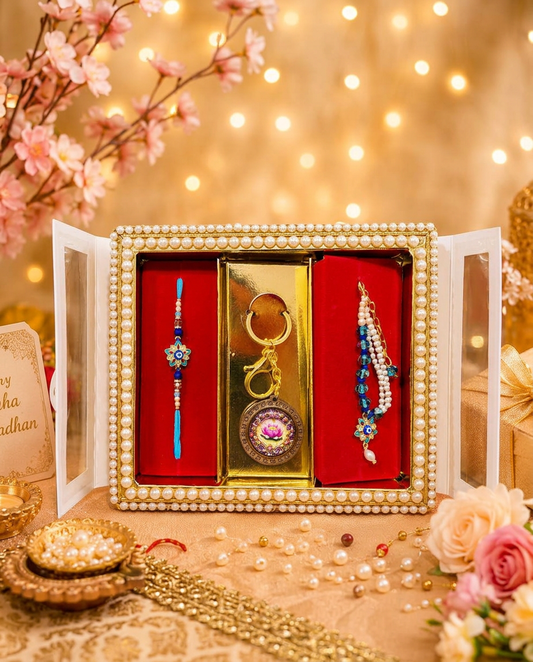 Premium Evil Eye Bhai Bhabhi Rakhi Gift Set featuring a blue designer rakhi, matching lumba rakhi, and lotus keychain in festive gift box for Raksha Bandhan.